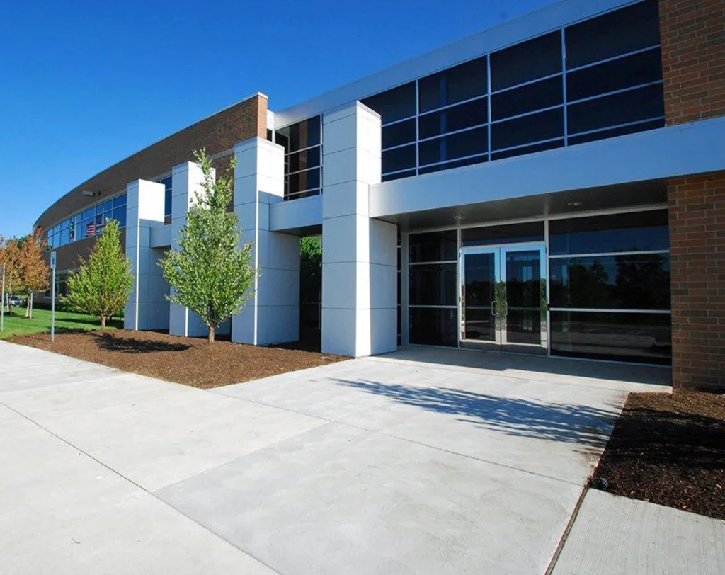 Farathane building entrance with brick and white panel walls