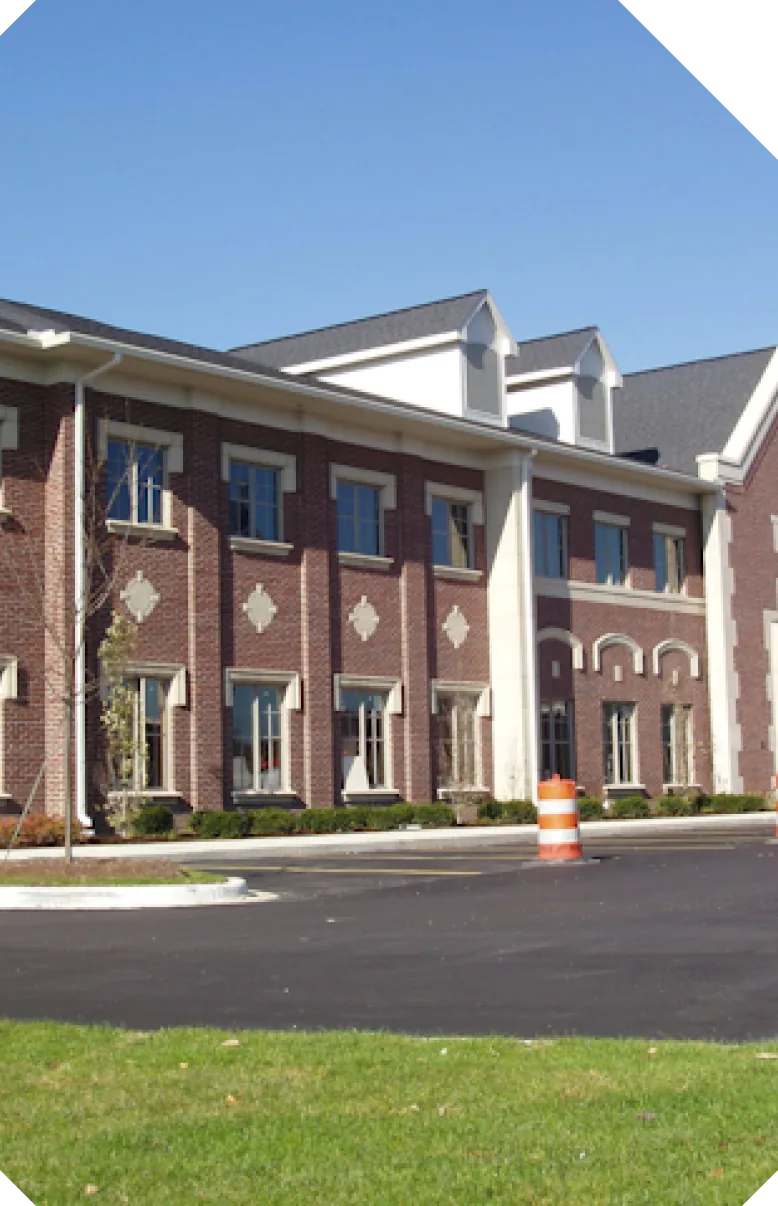 Three-story brick office building with white trim